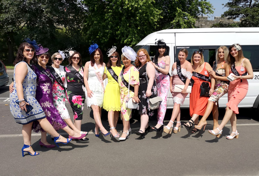 Ladies Day at the races – A group ready to enjoy their trip on a 16 seater with Lancaster Minibuses